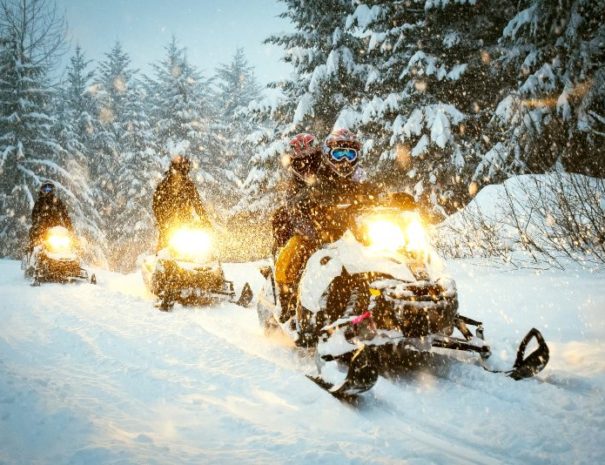 Snow mobile in blizzard, Point Carniel Lodge